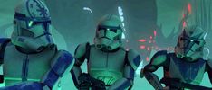 three star wars characters are standing in front of each other