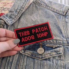 someone is holding a patch that says, this patch adds 10hr