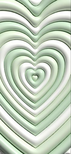 a heart shaped object is shown in the middle of an abstract image with white and green colors