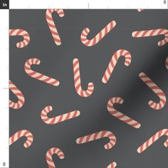 candy canes on grey background with red and white stripes