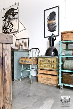 an old fashioned sewing machine sitting on top of a wooden table next to other antique items