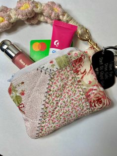 a small purse with various items on it