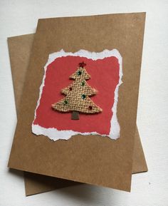 a card with a christmas tree made out of burlap on top of brown paper