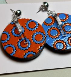 Hand painted, laser cut and designed by us, these one and a half inch diameter wooden earrings are colorful, light, and just so fun! Silver plated post. Tiny Paintings, Earrings Wood, Hand Painted Earrings, Space Girl, Jewelry Flower, Painted Earrings, Painted Jewelry, Paintings Art, Art To Wear