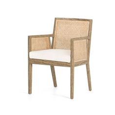 an outdoor chair with wicker back and white cushion on the seat, side view