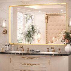 a bathroom vanity with two sinks and a large mirror