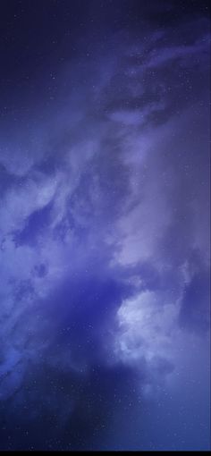 the night sky is full of stars and clouds, as well as some dark blue hues