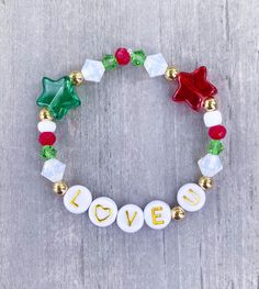 Love You Christmas Bracelet ️ Made with 18k gold filled beads. Personalize with name or word, please add in Personalization Section* CARING TIPS FOR YOUR JEWELRY ⭐️Treat and store with care. ⭐️ For longevity, avoid exposing your jewelry to water. ⭐️ Avoid having direct contact with lotions, perfumes, sanitizers as these chemicals may cause discoloration of your jewelry Festive Adjustable Personalized Bracelets, Gold Beaded Christmas Bracelets, Adjustable Gold Beaded Bracelets For Holiday, Personalized Adjustable Beaded Bracelets For Christmas, Gold Beaded Bracelets For Christmas, Personalized Adjustable Jewelry For Holiday, Personalized Adjustable Jewelry For Holidays, Adjustable Stretch Bracelet Gift For Christmas, Adjustable Beaded Bracelets For Holiday Gifts