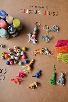 many different types of toys and beads on a table