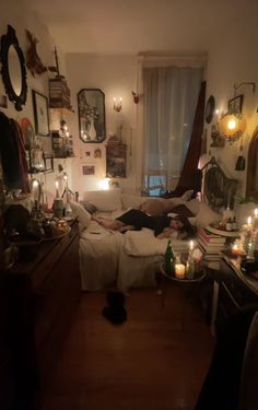 a living room filled with furniture and lots of candles