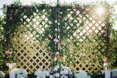 an outdoor wedding setup with flowers and candles