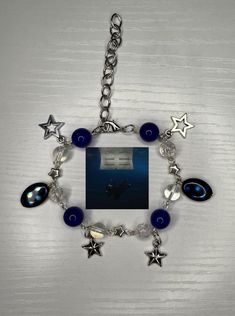 a bracelet with blue beads and silver stars