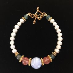 Delicate And Feminine Freshwater Pearl, Faceted Blue Lace Agate, Strawberry Obsidian And Green Chalcedony Beads, 18k Gold Vermeil Decorative Rondelles And Striking Square Toggle Clasp. One Of A Kind. Created By The Designer. New With Tags, Gift Boxed. 8” Including Toggle Clasp. Non Smoking Pet Free Closet. Weekday Shipping Only. Thanks For Visiting My Closet. Elegant Multicolor Pearl Bracelet With Gemstone Beads, Strawberry Obsidian, Izrada Nakita, Tassel Bag Charm, Square Beads, Green Chalcedony, Diy Bracelets Patterns, Wire Work Jewelry