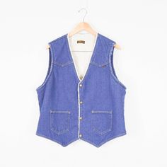 "Amazing 70s denim Sherpa vest! Excellent vintage condition! Fits like a men's Medium, women's Large. See detailed measurements below to ensure the desired fit as fit preferences vary. ✂-----Measurements Chest (armpit to armpit multiplied by 2): 46\" Length (Shoulder to Hem): 23\" To ensure a good fit, please compare the above measurements against articles of your own clothing laid flat that you feel fit well. We'd be happy to answer any questions regarding this item to ensure a happy and succes 70s Vest, Retro Vest, Cowboy Vest, 70s Denim, Fall Vest, Sherpa Vest, Winter Vest, Jean Vest, Vest Outfits