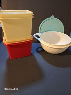 three different colored dishes are sitting on the counter top next to each other, one is empty