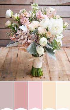 a bouquet of white and pink flowers in a vase on top of a wooden table