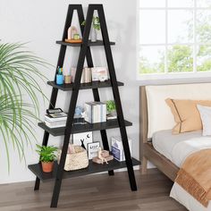 a black leaning shelf with books and plants on it next to a bed in a bedroom