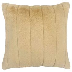 a cream colored pillow with wavy lines on the front and back, made out of sheep fur