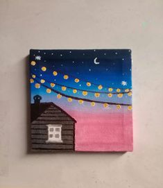 a painting of a house with lights hanging from it's roof and the moon in the sky