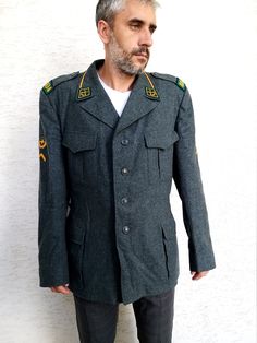 "Military Clothing Mens military jacket Swedish Military uniform military coat Military blazer Militaria Army Jacket Army blazer XXL height of the men in the photo - 187 cm Please refer to photos for details of condition. Condition: very good vintage Length: 81 cm/ 31.9 \" Shoulder to shoulder: 52cm/ 20.5\" Sleeve: 67 cm/ 26.4\" Bust: 126 cm / 49.6\" Waist: 116cm/ 45.7\" Size: ХXL note The color on the pictures may vary due to monitor settings and light reflections. Ready to ship Please do not h Military Double-breasted Blazer With Pockets, Military Style Double-breasted Blazer With Pockets, Military Style Long Sleeve Single Breasted Blazer, Military Style Single Breasted Long Sleeve Blazer, Winter Military Sport Coat, Khaki Military Style Winter Blazer, Military Style Khaki Blazer Single Breasted, Military Style Single Breasted Khaki Sport Coat, Military Style Khaki Sport Coat With Button Closure