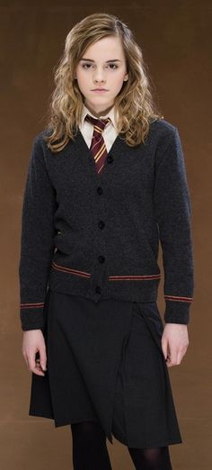 a woman in a harry potter costume posing for the camera with her hand on her hip