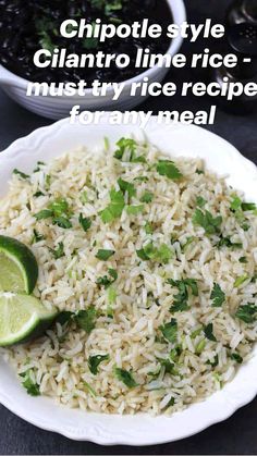 a white plate topped with rice and garnished with cilantro