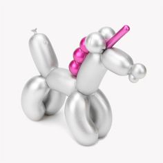 an inflatable balloon dog with a pink bow on its head is shown against a white background