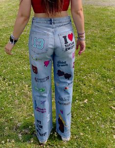 the back of a woman's jeans with stickers all over her butts