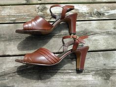 Vintage Summer Heels With Block Heel, Vintage Formal Sandals With 4-inch Heel, Vintage Block Heel Heels For Summer, Vintage Brown Sandals For Formal Occasions, Brown Vintage Ankle Strap Heels, Vintage Heels With Ankle Strap, Vintage Heels With Heel Strap For Spring, Vintage Brown Ankle Strap Heels, Vintage Heels With Heel And Ankle Straps