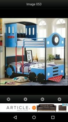 a child's bedroom with a blue train bunk bed