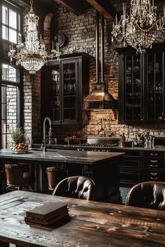 an old - fashioned kitchen with black cabinets and chandelier hanging from the ceiling