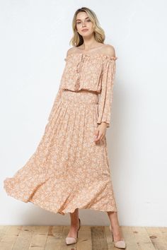 Dress to impress in our peachy floral Aya Off the Shoulder Top & Skirt Set. The long-sleeved top features an elegant off-the-shoulder design while the skirt boasts a flattering A-line silhouette. This set will make you feel confident, stylish, and so cutep> Details: 100% Rayon Long Sleeve Maxi Dress With Floral Print, Spring Beige Long Skirt Dress, Spring Beige Dress With Long Skirt, Beige Flowy Maxi Dress For Spring, Spring Beige Tiered Skirt Maxi Dress, Spring Flowy Off-shoulder Maxi Dress, Flowy Maxi Skirt For Spring Brunch, Flowy Off-shoulder Maxi Dress For Spring, Off-shoulder Maxi Dress For Spring Brunch