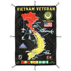 the vietnam veteran map is hanging on a wall in front of an american flag and other flags