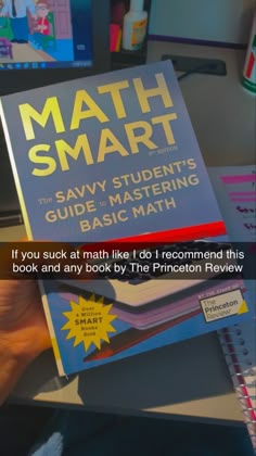 a person holding up a book with the title'math smart'in front of them