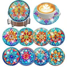 colorful plates and cups with designs on them are arranged next to a coffee cup, which is decorated with flowers