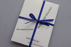 a gift wrapped in blue and white paper