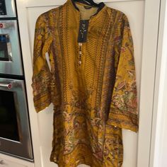 Reposhing This Item I Purchased From @Ambreenc1. Seller Listed It As 100% Silk. I Can't Find A Label To Confirm This, But It Does Feel Like Silk. New And Never Worn. Questions? Leave A Comment Below! Casual Yellow Kurta With Printed Motifs, Long Sleeve Floral Print Top For Eid, Yellow Long Sleeve Top With Printed Motifs, Casual Floral Print Festive Blouse, Casual Festive Floral Print Blouse, Festive Casual Floral Print Tops, Casual Long Sleeve Yellow Kurta, Casual Yellow Long Sleeve Kurta, Casual Long Sleeve Tunic For Eid