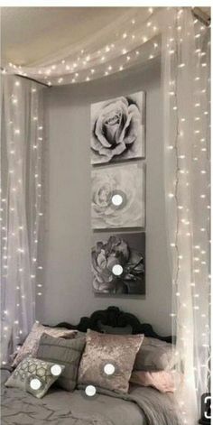 a bedroom decorated with lights and pictures on the wall