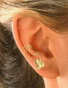 Ear Charms Playful non-pierced Leaping Frog Curly-Q Ear Cuff Adds a Splash to Accent Any of Your Regular Earrings. Lucky Frog Ear Cuff Earrings. Sandra Callisto Designs, Laguna Beach CA, USA ‚© Ear Charms Inc 1982 - 2021 Adjustable Gold Cartilage Earrings For Party, Adjustable Gold Ear Cuff With Ear Wire, Adjustable Gold Ear Cuff, Adjustable Gold Wrap Earrings For Wedding, Long Ear Cuff, Heart Ear Cuff, Flower Ear Cuffs, Leaf Ear Cuffs, Minimalist Ear Cuff