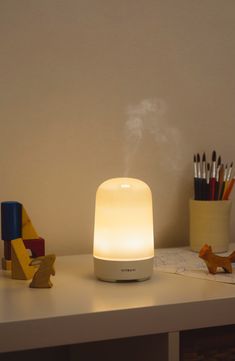 What it is: An essential oil diffuser that lights up to create a soft ambiance while scenting your home naturally. What it does: With a cute curved silhouette and compact size, it instantly elevates the vibe in any room while using ultrasonic vibrations to diffuse the fragrance. It's designed with durable materials and safety-off switches so you can operate it entirely free of hassle of worry.Diffusing capacity: 300 sq. ft. 3.4"W x 5.5"H Ultrasonic: 2.5 vibrations/second 4-hour and 8-hour settings Automatically turns off when time is up or water runs out BPA-free Plastic Imported Room Diffuser, Scent Diffuser, House Smells, Candle Diffuser, The Vibe, New Room, Essential Oil Diffuser, Oil Diffuser