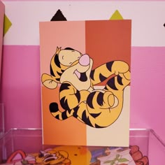 a winnie the pooh card sitting on top of a table