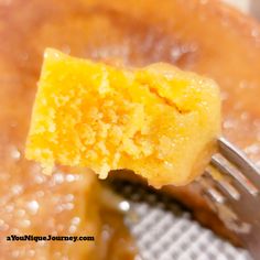 a close up of a piece of cake with a fork sticking out of the middle