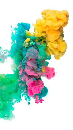 multicolored ink floating in water on white background