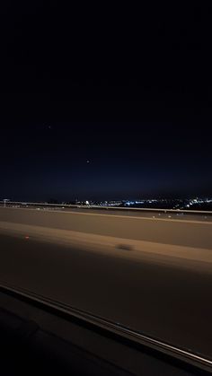 an airplane is flying in the sky at night with its lights on and it appears to be blurry