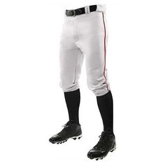 a baseball player in white pants and black shoes