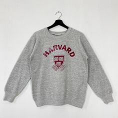 Vintage 80s Harvard University Sweatshirt Harvard University Crewneck Harvard Sweater Pullover Harvard Crimson Print Logo Grey Small 𝐁𝐫𝐚𝐧𝐝 :- Harvard University  𝐒𝐢𝐳𝐞 𝐓𝐚𝐠 :- Medium 𝐒𝐢𝐳𝐞 𝐑𝐞𝐜𝐨𝐦𝐦𝐞𝐧𝐝 :- Fits Small Manual Measurement :- 𝐖𝐈𝐃𝐓𝐇 (armpit to armpit) :- 20.5 inches / 52cm 𝐋𝐄𝐍𝐆𝐓𝐇 (shoulder to end of garment) :- 24.5 inches / 62cm 𝐂𝐨𝐧𝐝𝐢𝐭𝐢𝐨𝐧 :- Good Condition 8/10.                      - Minor Defect Paint Stain Refer Picture. Vintage Sweater With Letter Print And Long Sleeves, Vintage Fall Sweater With Letter Print, Vintage Long Sleeve Sweater With Letter Print, Vintage Letter Print Sweater For Fall, Vintage Graphic Print Top For Campus, Crew Neck Sweater For Campus In Winter, Winter Crew Neck Sweater For Campus, Retro Long Sleeve Tops For School, Vintage Long Sleeve Sweatshirt With Letter Print