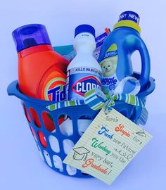 a laundry basket filled with cleaning products and a note pinned to the front of it