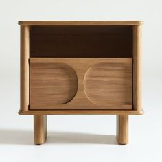 a wooden cabinet with two circles on the front and one circle on the back, against a white background