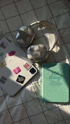 an open notebook sitting on top of a white tiled floor