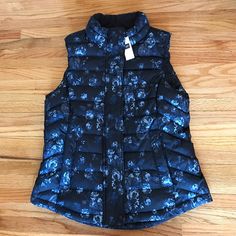 Nwt Gap Floral Vest. Size: Small. Color Is Dark Navy Blue With Different Shades Of Blue Flowers & Gray Pattern Throughout Vest. Zipper & Snap Button Closure. 2 Pockets. Fully Lined. Looks Great Paired With Blue Jeans! Machine Wash. Tumble Dry. No Trades. Final Price !No Offers! Gap Black Spring Outerwear, Spring Black Outerwear By Gap, Black Gap Outerwear For Spring, Fitted Blue Outerwear From Gap, Vest Zipper, Floral Vest, Floral Vests, Gap Jacket, Gap Jackets